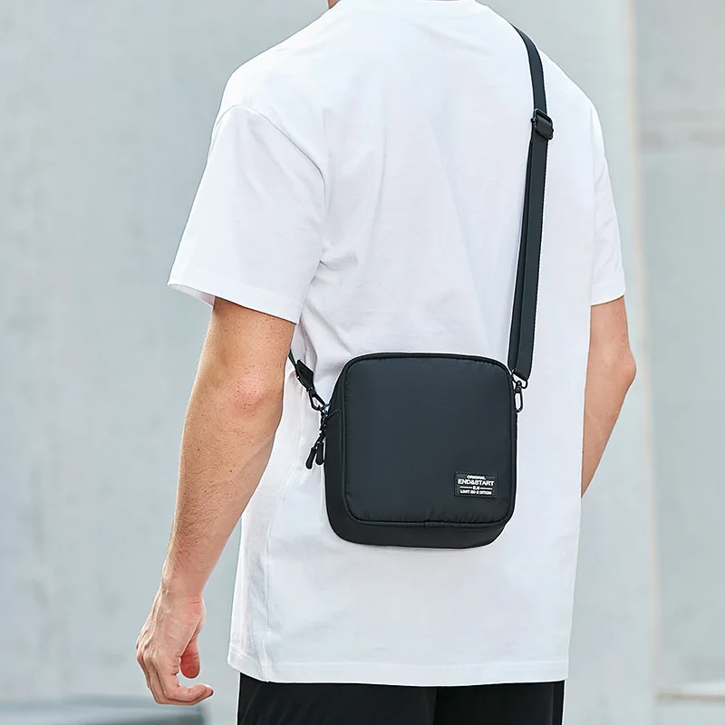 Small Men's Black Crossbody Bag with Zipper Closure and Logo Patch Casual Square Shoulder Purse for Daily Travel Work