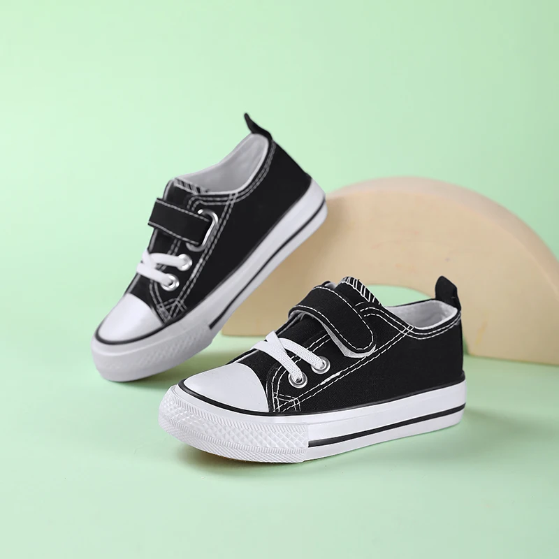 

A pair of kids' easy-on canvas sneakers with hook-and-loop strap, soft sole, perfect for everyday comfort and casual play XN-677