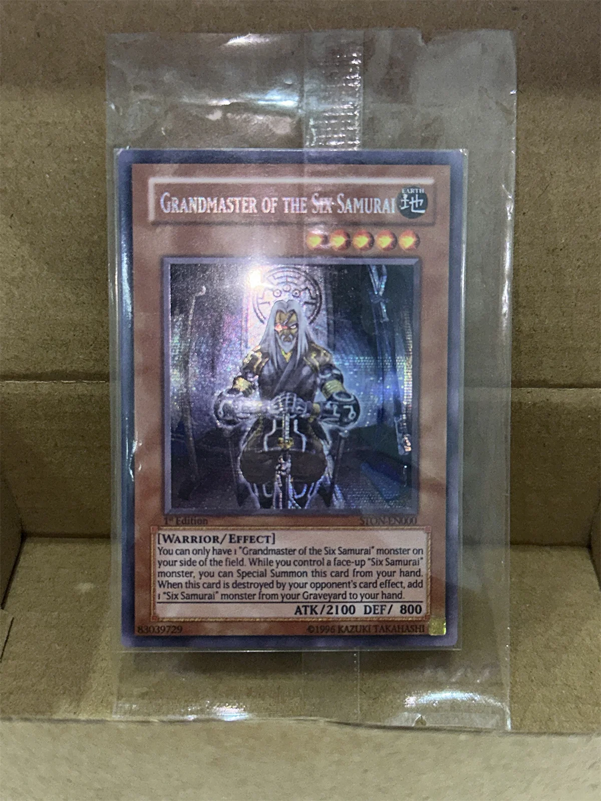 

Yu-Gi-Oh TCG Grandmaster of the Six Samurai STON-EN000 Magia Series Children's Gift Collection Board Game Toy Card (No-Original)