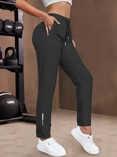 Imagen 1 del producto Pantalones casuales de mujer | Tela elástica, adecuada para exteriores y fitness, cintura con cordón, color sólido, longitud larga