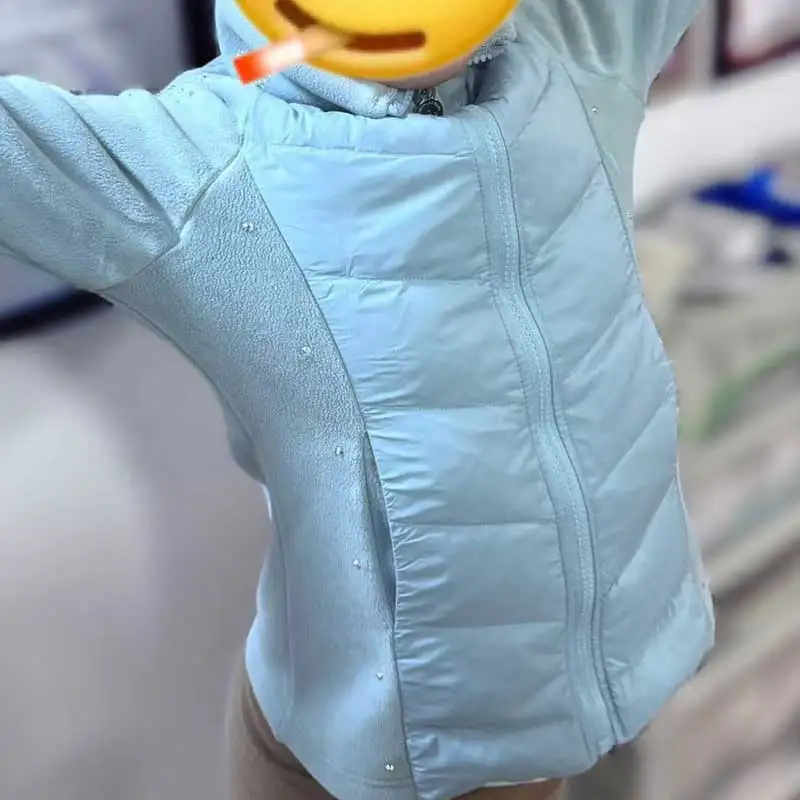 

Тренировочная куртка для фигурного катания с наполнителем из 90% белого утиного пуха, которую можно носить для катания на зимних фигурных коньках