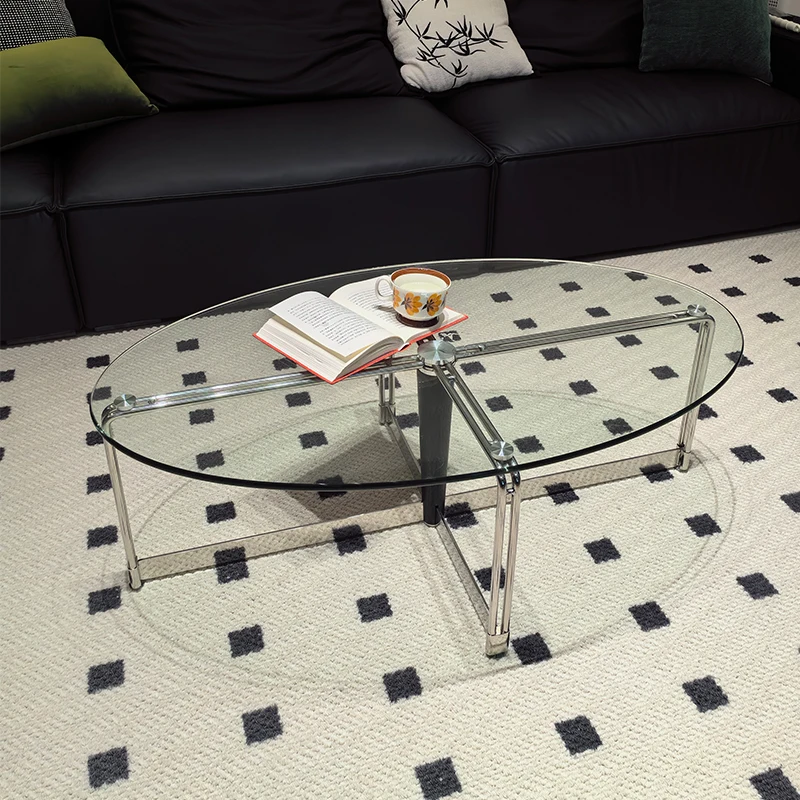 

Oval stainless steel coffee table, minimalist tempered glass