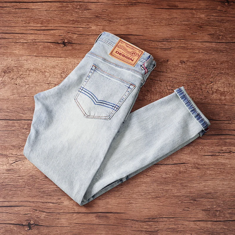 

Fashionable high-end men's denim pants with elastic slim fit, small straight tube, light blue washed and worn denim pants