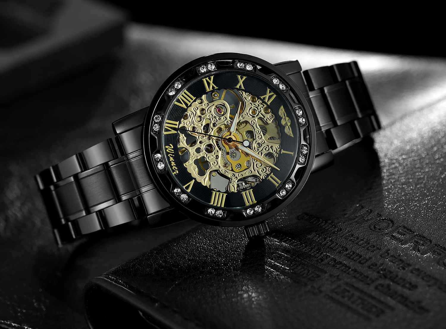 T-WINNER แฟชั่นลำลองบุรุษนาฬิกาโครงกระดูกกลไกแกะสลักหรูหราไรน์สโตนตัวชี้ส่องสว่างคูลแบล็คแมนนาฬิกาข้อมือ