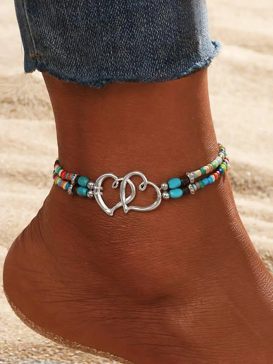 

Boho-Inspired Multi-Strand Anklet Featuring Interlocking Silver Double Heart Charm And Colorful Beads For Summer Beach Wear