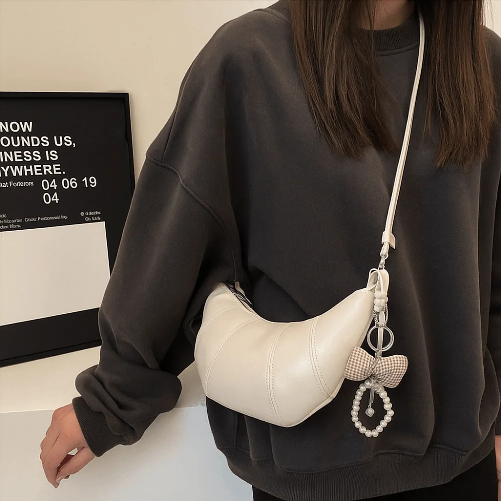 

Elegant Croissant Shoulder Bag PU Leather Bowknot Pearl Pendant Underarm Dumpling Bag Solid Color Korean Style Crossbody Bag