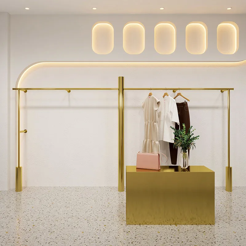 

Настенная вешалка для одежды от пола до потолка из нержавеющей стали с титановым золотым покрытием для демонстрации женской одежды в магазине.