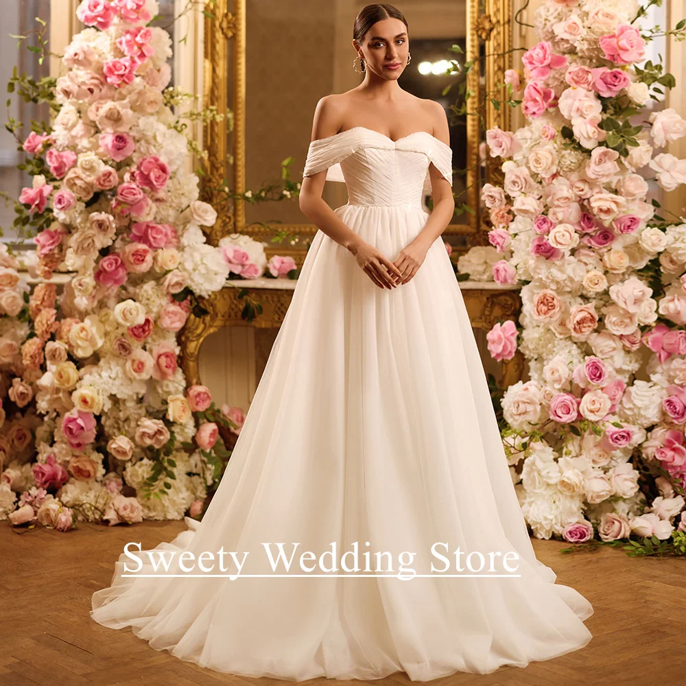 فستان زفاف من Vestidos De Novia مخصص قبالة الكتف ورقبة على شكل V لؤلؤ مطرز على شكل حرف A سويب تراين ناعم من التل فستان العروس