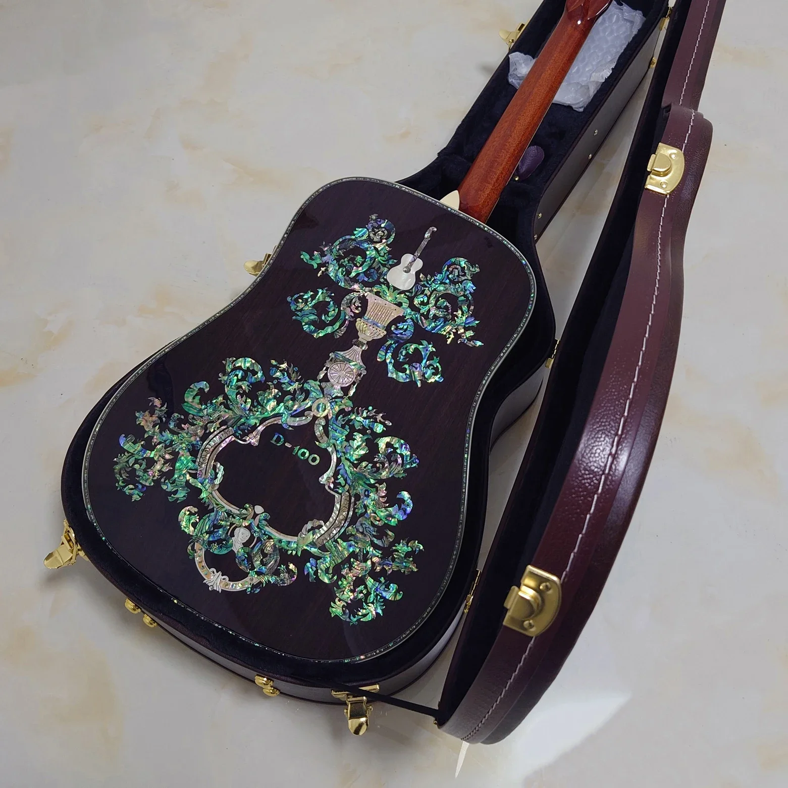 All Solid Wood Acoustic Guitar, Solid Spruce Top, Rosewood Body, 100 Type Abalone Inlays, Bone Nut, Gold Tuners with Case All Solid Wood Acoustic Guitar, Solid Spruce Top, Rosewood Body, 100 Type Abalone Inlays, Bone Nut, Gold Tuners with Case