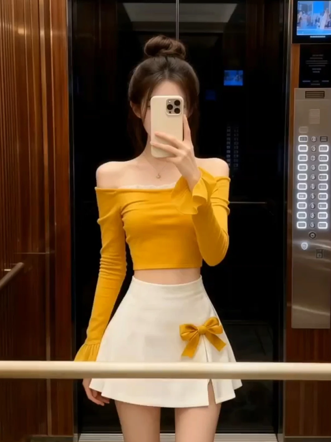

Pure Gold Yellow One-Shoulder Long Sleeve Top with Knot Half Skirt Two-Piece Set for Women Elegant Age-Defying Ense...