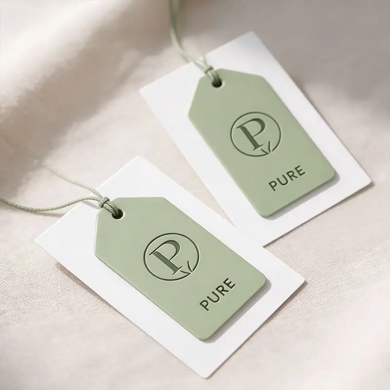 Custom Luxury Embossed Logo Paper Hang Tags Personalized Brand Price Labels For High‑End Clothing Handbags And Shoes Accessories