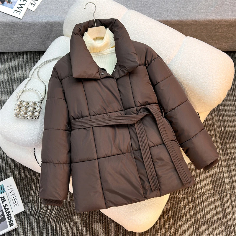 Chaqueta de plumón de invierno para mujer, chaquetas acolchadas de algodón ruso, cinturón delgado, temperamento, Parka larga gruesa y cálida, prendas de vestir holgadas y ajustadas, tendencia