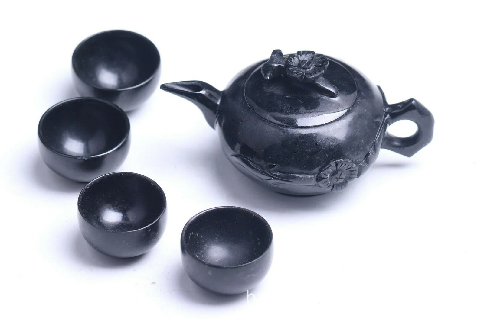 

Chinese hand carved natural jade Kung Fu tea set, teapot and four bowls