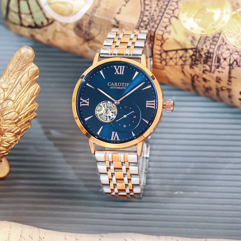 

A men's gold and blue steel strap stylish trendy tourbillon fully automatic mechanical watch
