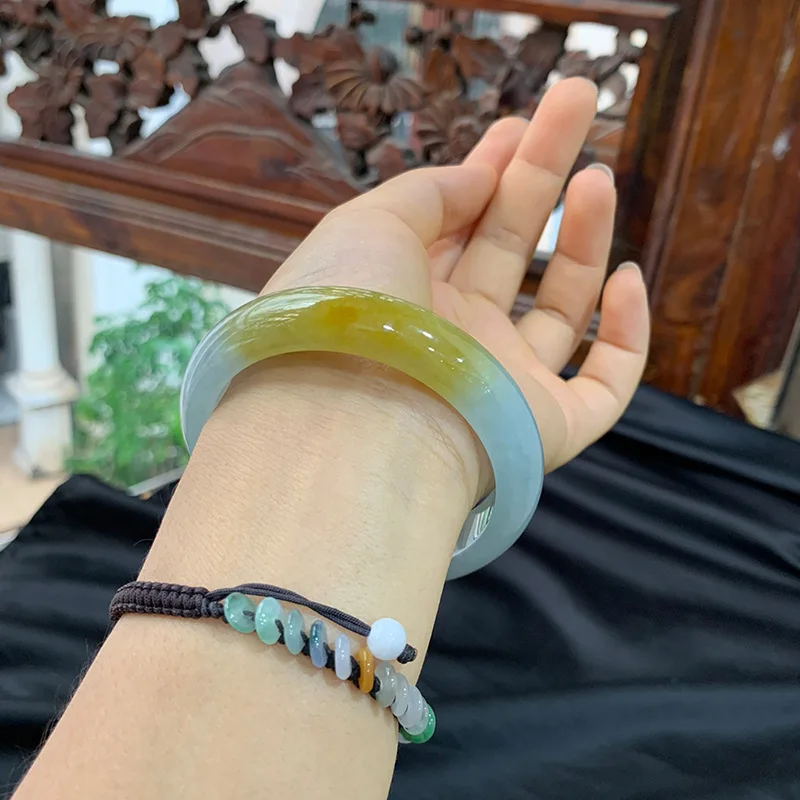 Genuine natural Burmese jade bracelet, featuring ice-like jadeite with a yellow hue and floral patterns, a classic circular desi
