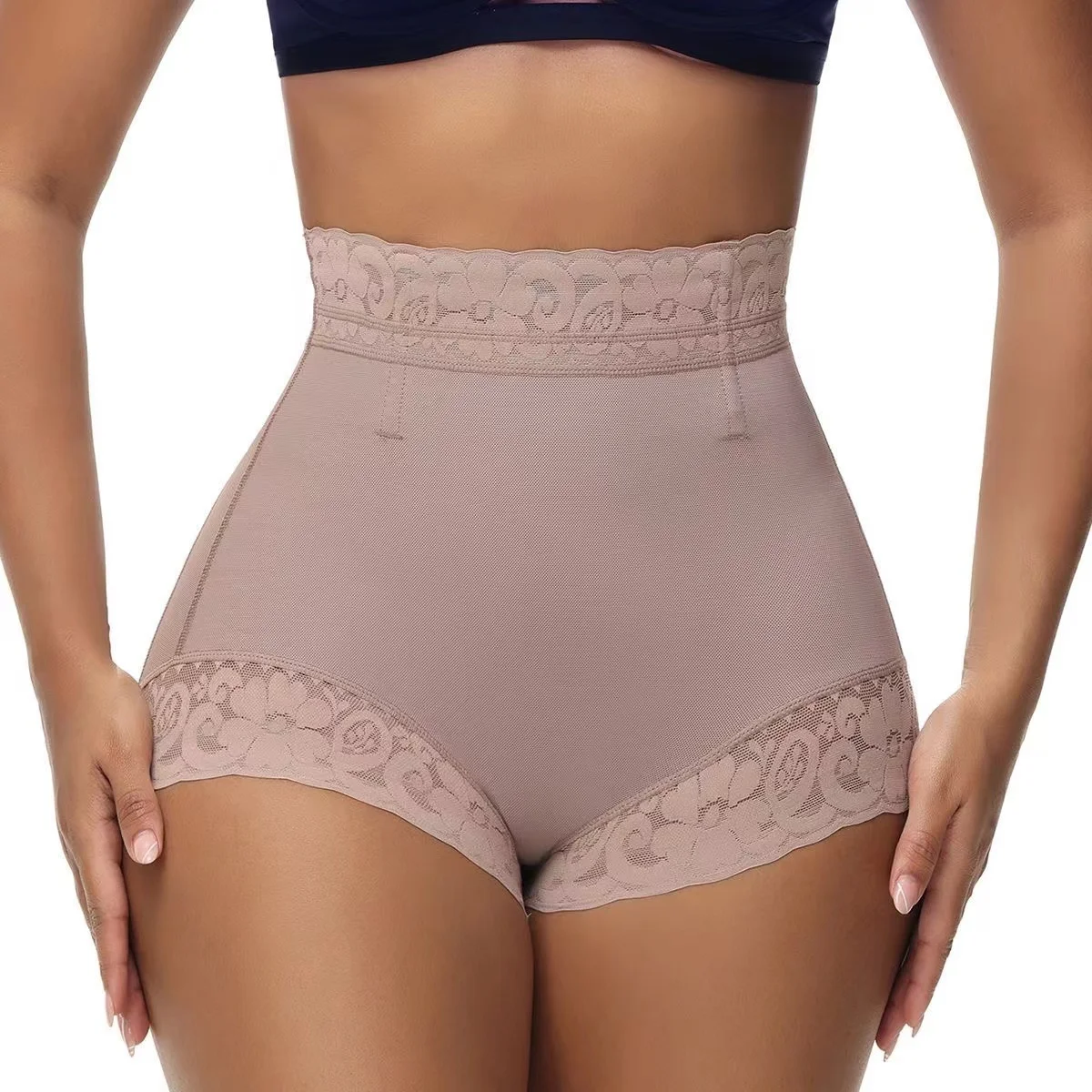 Butt shaper waist cinching and slimming pants with a tight fit, mid waist and flat angle shaping waist