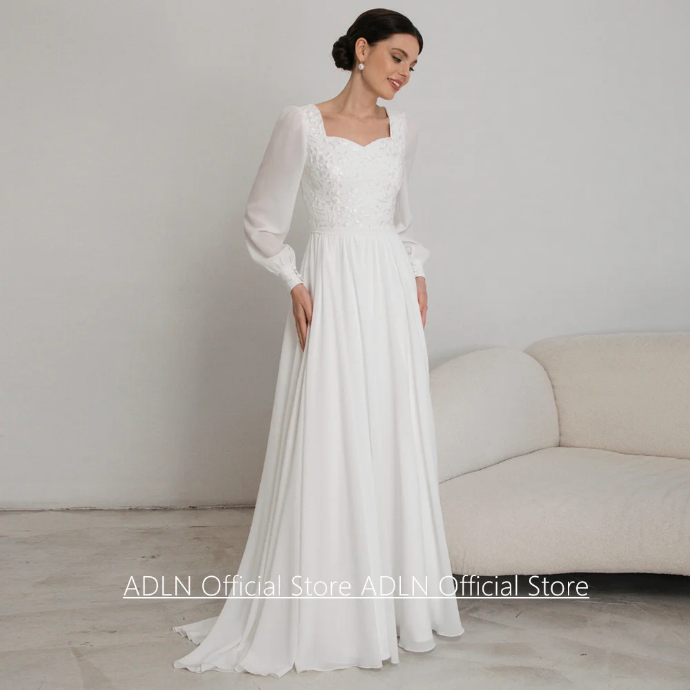 Neues Hochzeitskleid nach Maß mit Herzausschnitt, Puffärmeln, Spitzenapplikationen und Schleppe aus Chiffon für die Braut