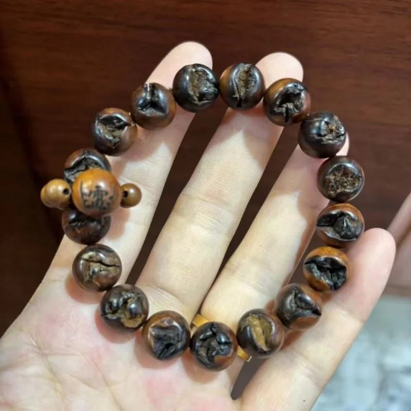 

Браслет из древесины унаби, обработанной после воздействия молнии, унисекс, изготовлен из древесины старых деревьев в горах, с натуральными свободными бусинами.