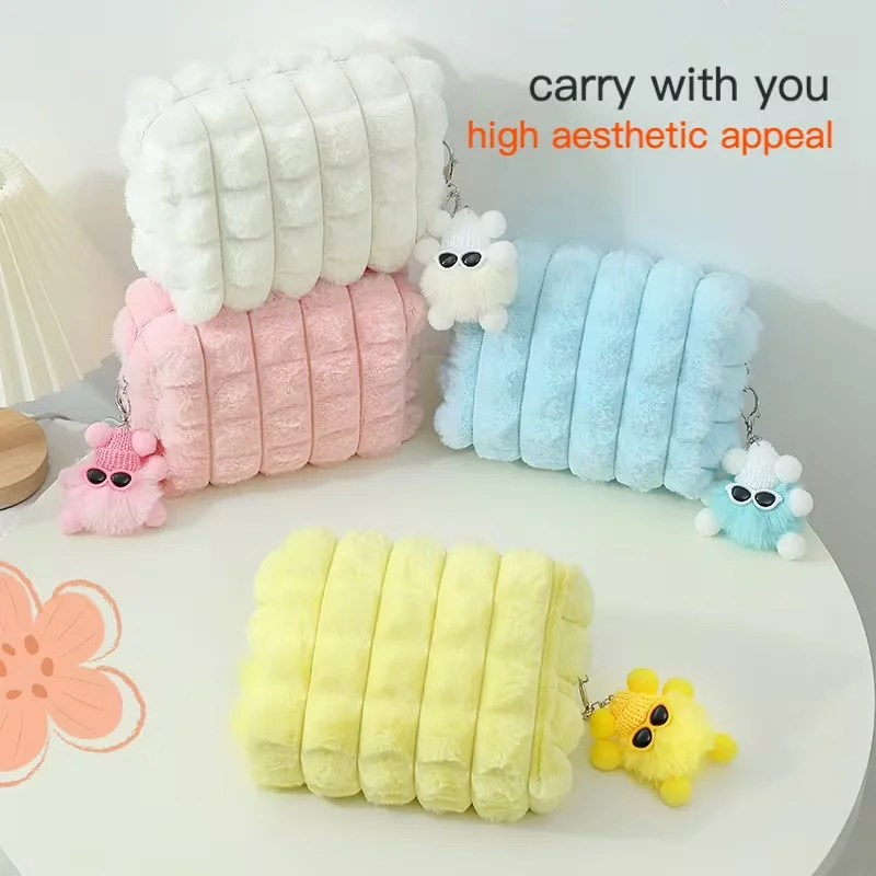 Large-capacity plush makeup bag with fluffy pendant - A soft-touch pink makeup bag, suitable for travel and household use.