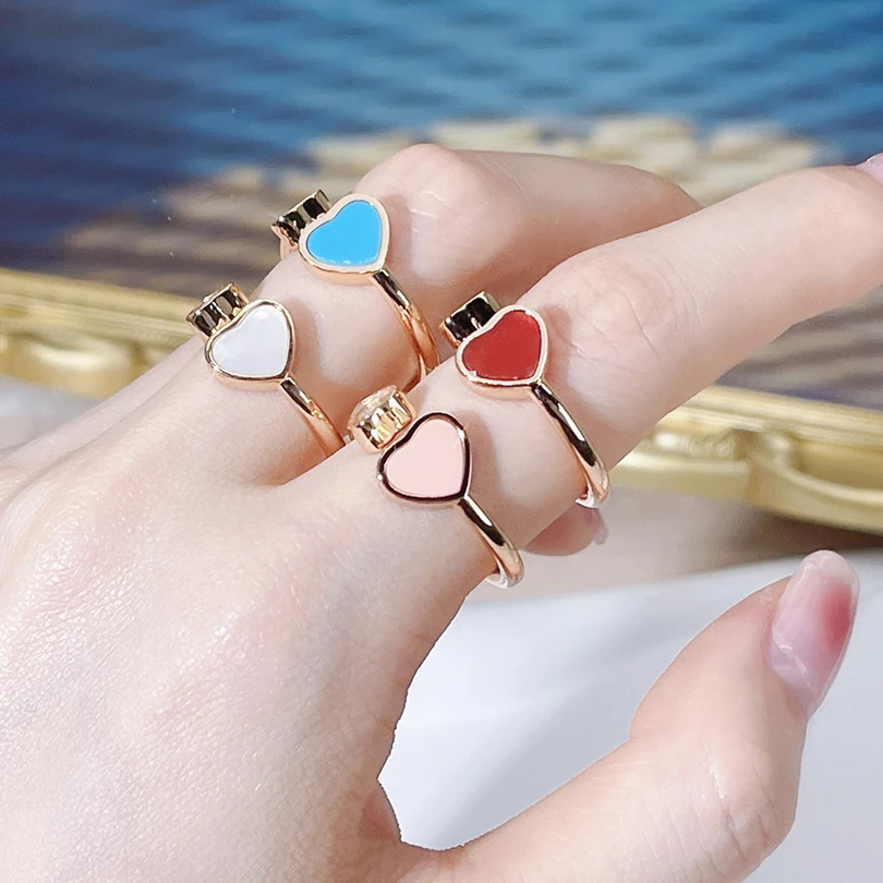 High end boutique women's heart-shaped ring, a shining stone sliding in the heart of love, open the video to see more