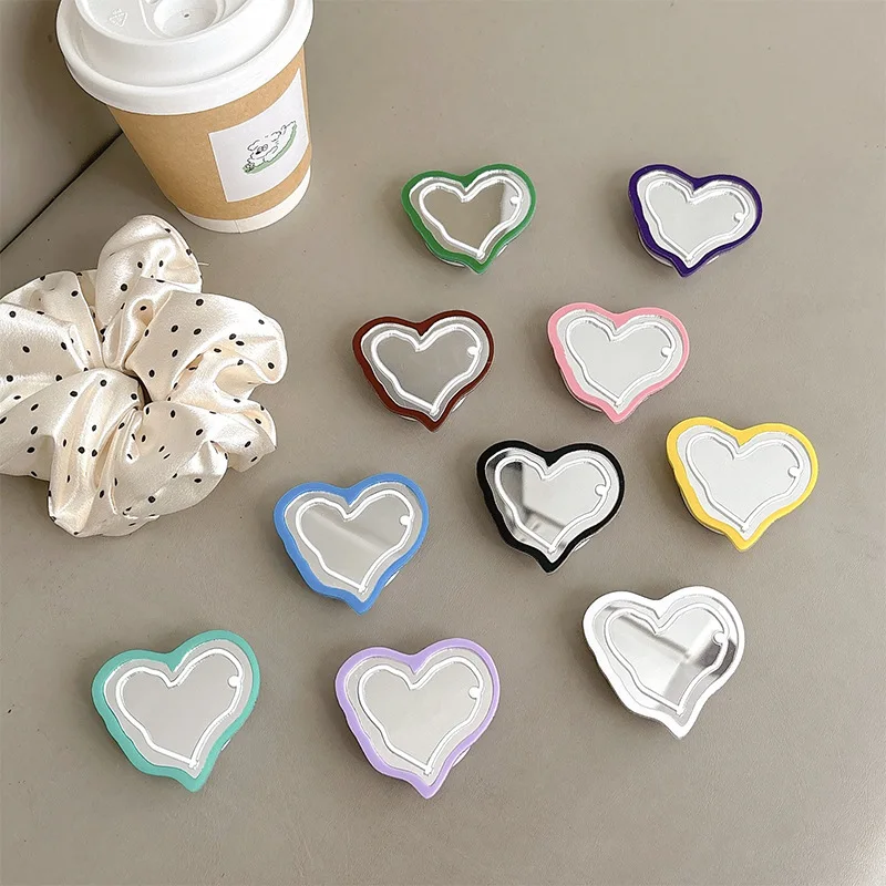 

Простой, яркий чехол для телефона с зеркалом в форме сердца, подставкой-подушкой безопасности и клейкой задней панелью для iPhone 17, держатель Griptok