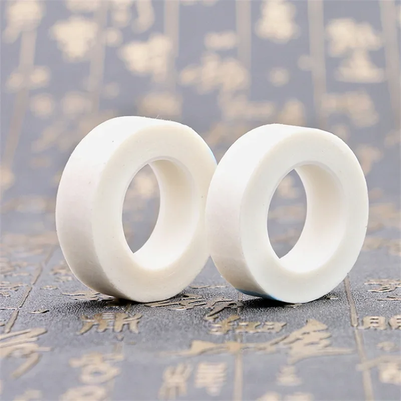 Cinta de papel para extensión de pestañas, cinta adhesiva de tela no tejida transpirable pelusa para parche de pestañas postizas, cinta de tatuaje