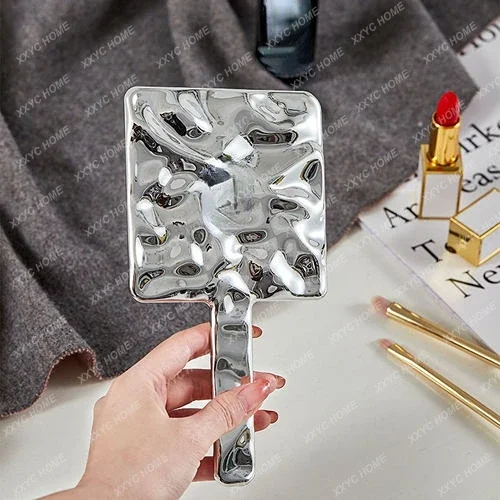 Hand held vanity mirror