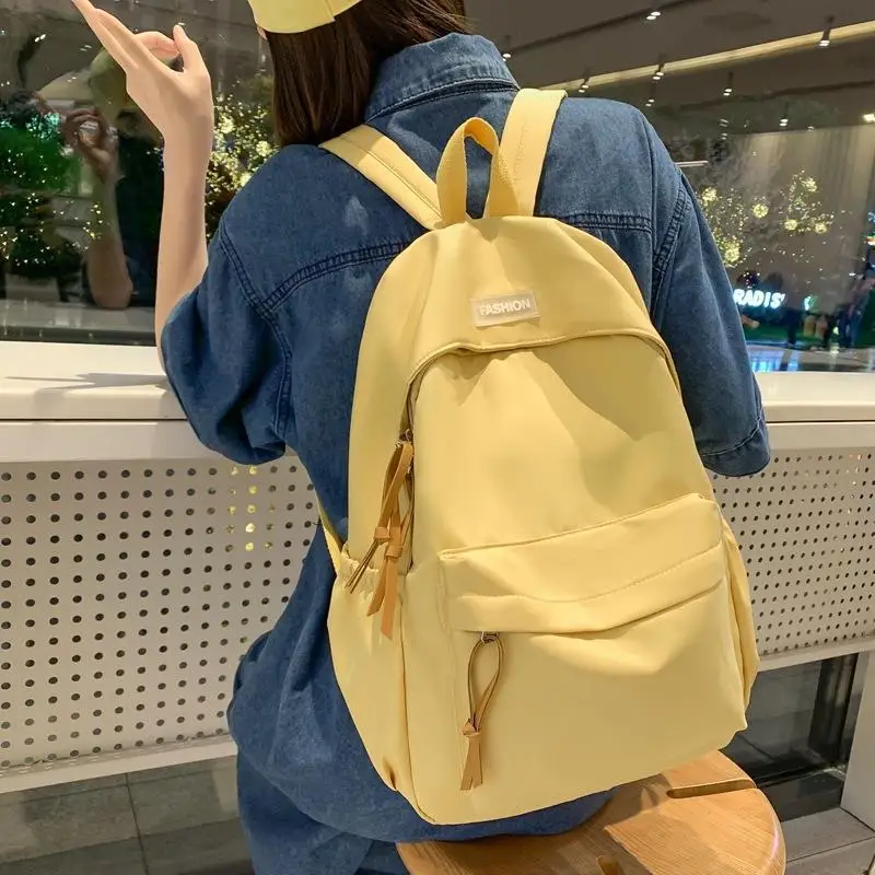 New Classic Solid Color Backpack with Tassel Zippers Large Capacity Casual School Bag for Teen Girls Daily Use