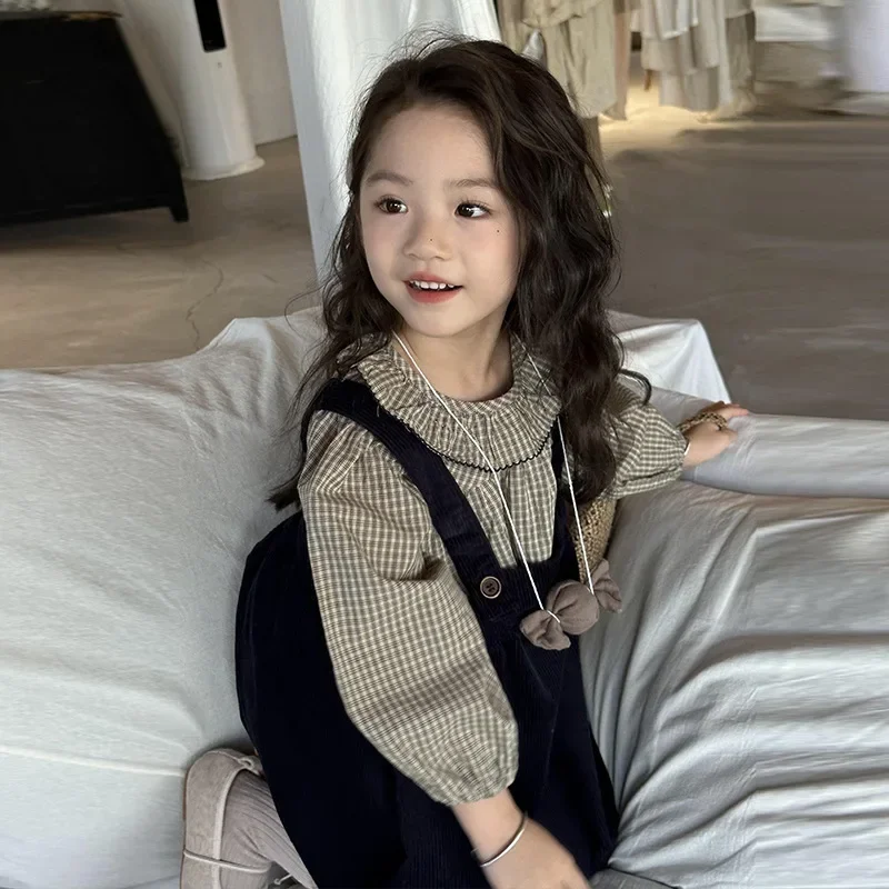 

Girls' fashion strap skirt 2024 autumn new children's Korean spring and autumn plaid shirt medium and small short skirt set