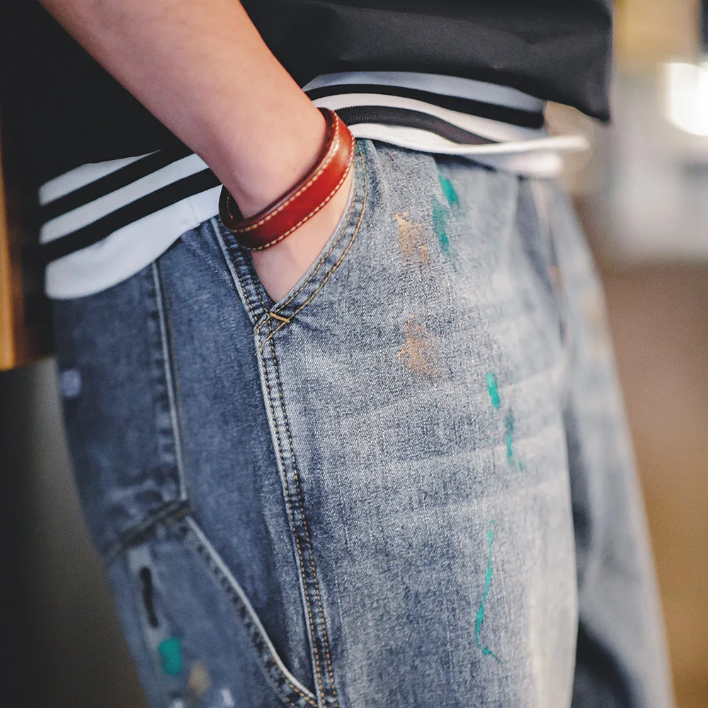 Maden Jeans Graffiti azzurri con inchiostro Splash per uomo Pantaloni da registrazione a gamba dritta lavati con texture fiammato da 9,2 OZ Jeans streetwear autunnali