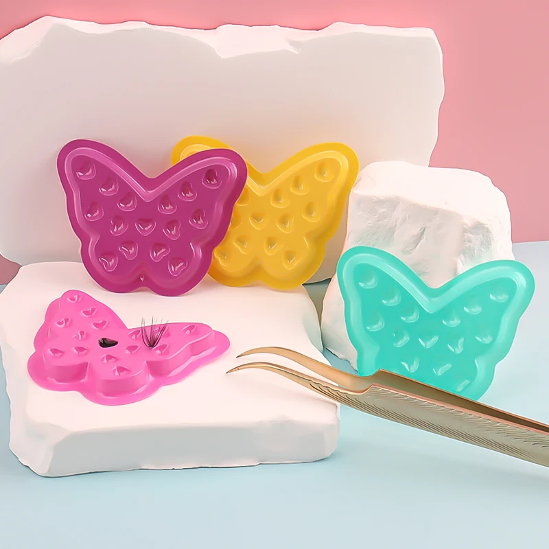 100 Uds forma de mariposa pegamento para pestañas postizas soporte junta extensión de pestañas paleta de plástico bandeja adhesiva herramientas de pigmento de tatuaje