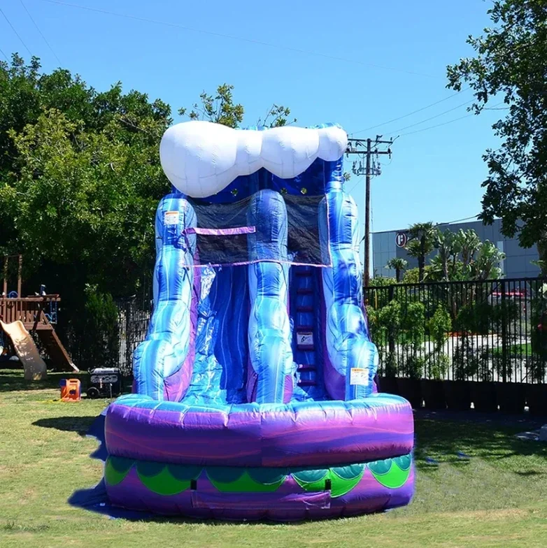 Inflatable water slide with children and adult swimming pool