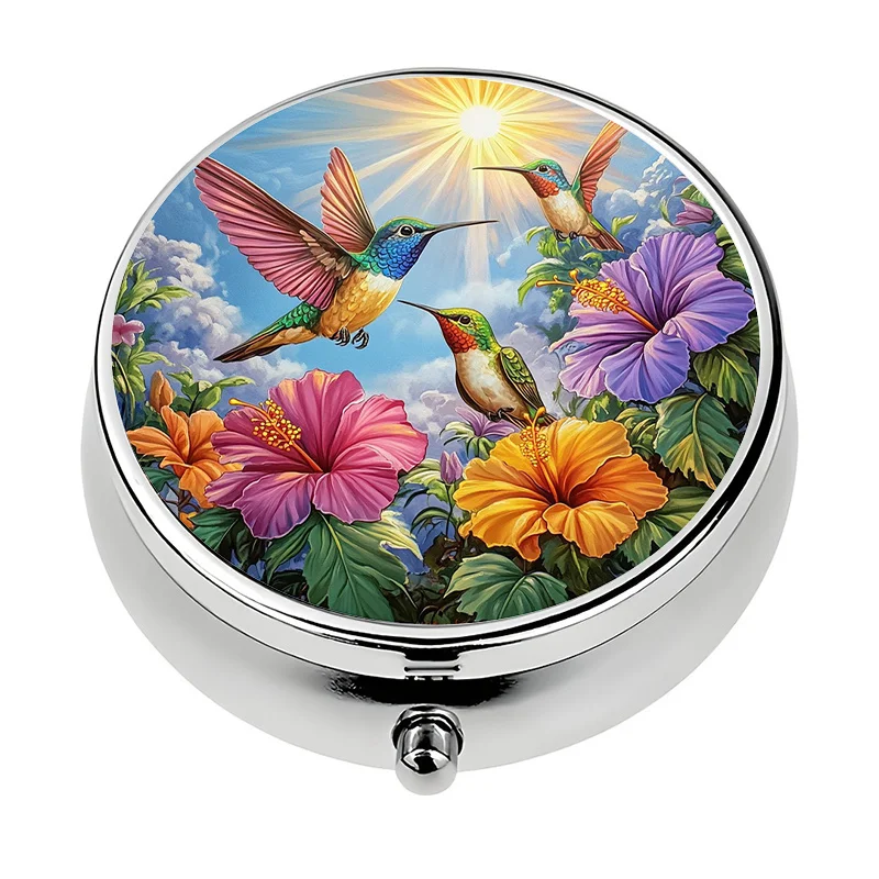 Single pill box, designed in a tropical paradise style, featuring hummingbird and hibiscus flower patterns, contains three compartments, perfect for travel and as a unique gift