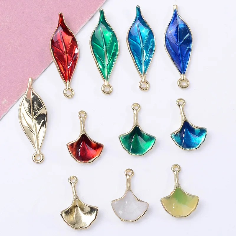 

100Pc set version single small leaf dripping oil ginkgo biloba alloy pendant DIY earrings collarbone chain pendant wholesale