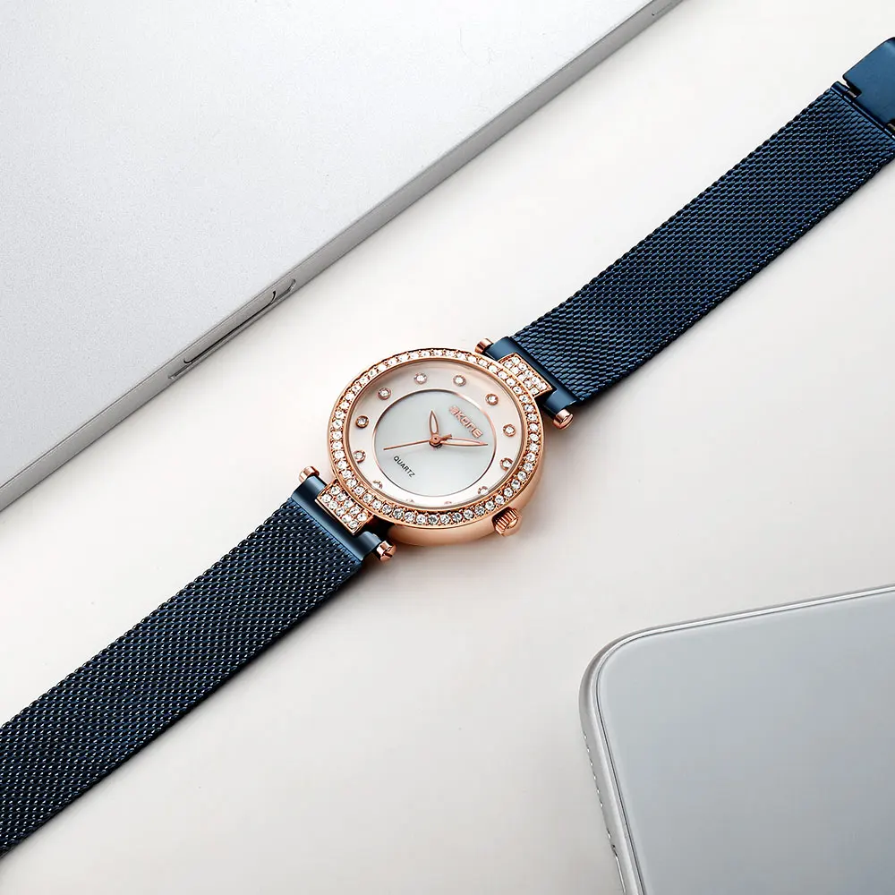 SKONE Diamond light lujo moda simple reloj de mujer correa de malla versión coreana casual temperamento reloj de cuarzo