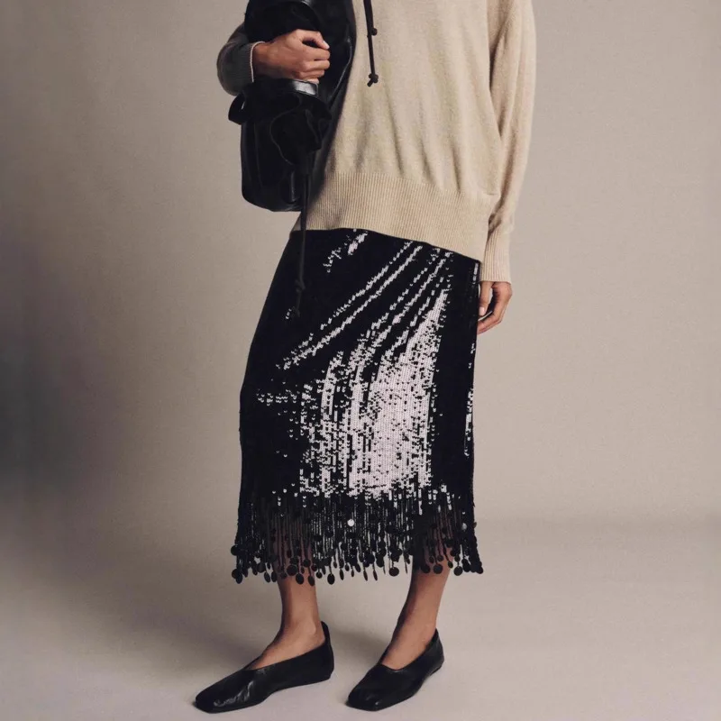 تنورة نسائية عصرية بشرابة ترتر للخريف والشتاء أنيقة من Demeanor بشرابة سوداء بقصة ضيقة عالية الخصر تنانير طويلة للتنقل اليومي