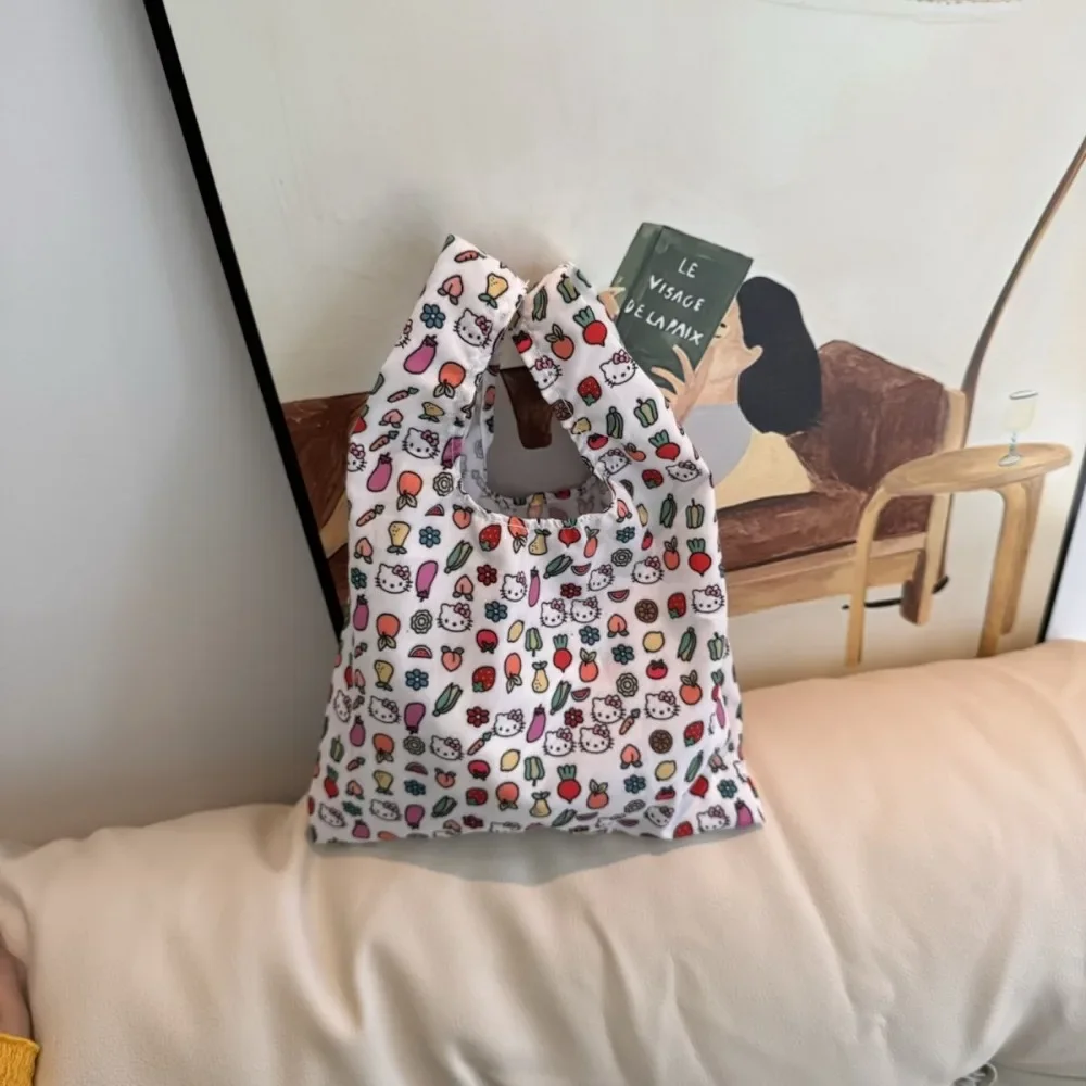 Bolso de mano de Hello Kitty, bolsa de muñeca portátil de gran capacidad, bolsa de caja de arroz, bolsa de almacenamiento de viaje con estampado de dopamina de lona linda, nuevo