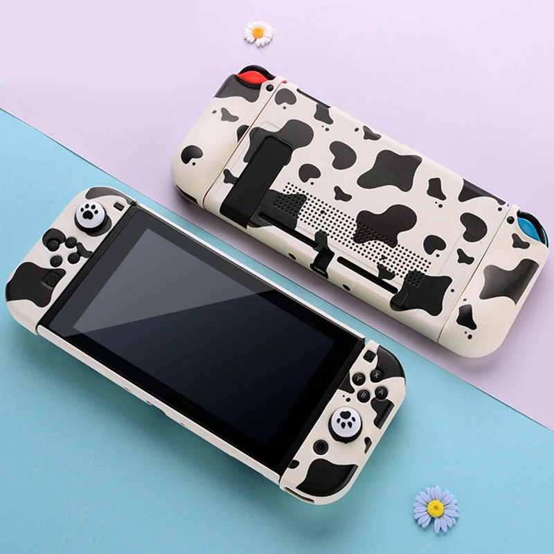Capa protetora dura de grão de vaca e capa macia JoyCon para Nintendo Switch/OLED com 1 par de apertos de polegar para Nintendo Switch Shell