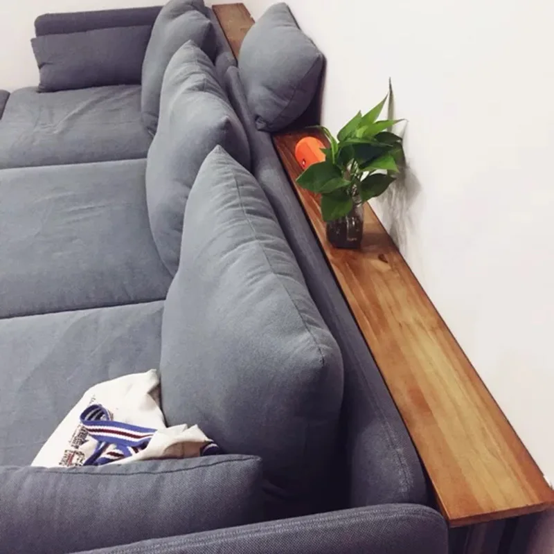 The living room sofa rear shelf is against the wall, and the solid wood bedside storage bookshelf cabinet is simple and narrow