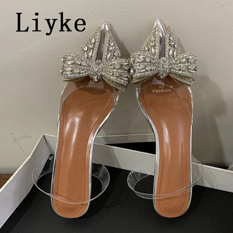 Liyke Fashion Design Crystal Bowknot Women Pumps Sexy punta a punta trasparente tacchi alti scarpe da ballo di nozze sandali trasparenti in PVC