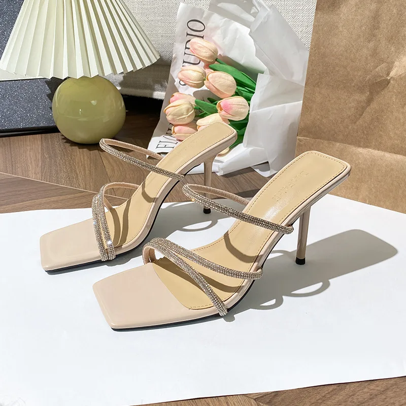 

French high-end rhinestone high-heeled one-word slippers women's 2025 summer new stiletto wear sandals temperament sandals