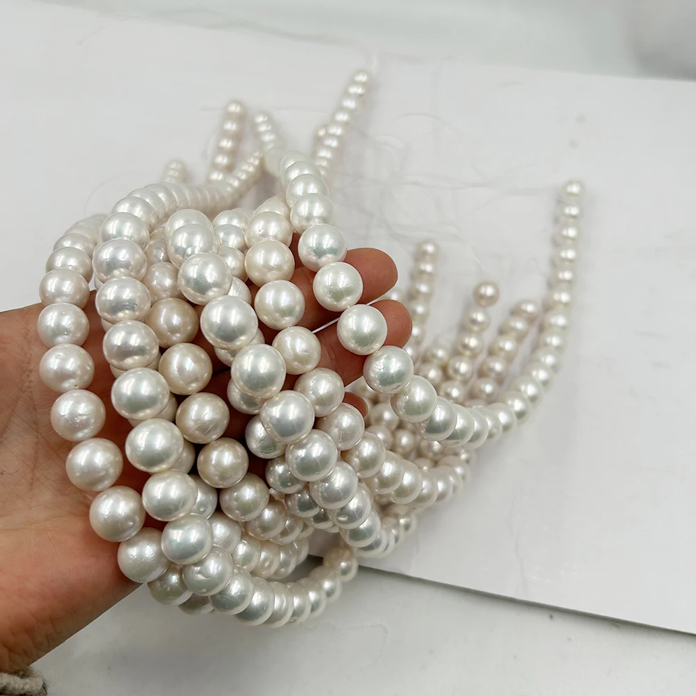 

free shipping,16 inch good luster 10-12 mm round AA grade,100% nature freshwater pearl material ,with nuclear have few flaws