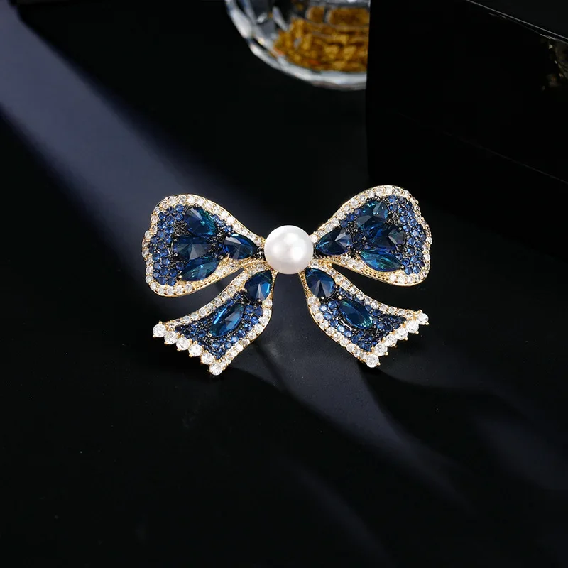 2025 Spilla di perle d'acqua dolce naturali di fascia alta, cappotto da abito elegante e lussuoso e accessori con spilla a fiocco