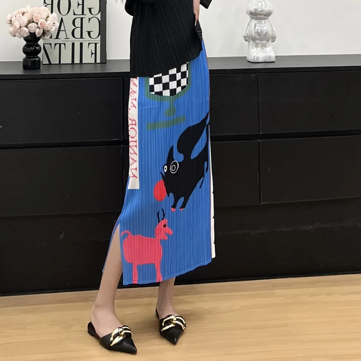 Mezza gonna casual a pieghe Miyake 2025 Estate nuova mezza gonna stampata allentata elasticizzata dal design alla moda