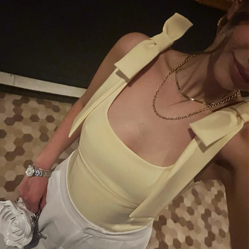 弓イエロートップ女性ノースリーブタンクトップ甘いかわいい女性のトップス夏 2025 バックレストップオフィスレディーストップスストリート