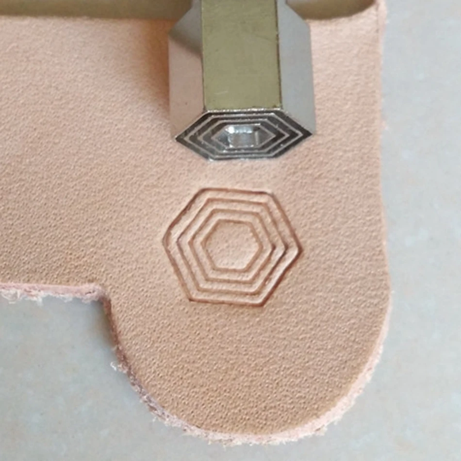

Leathercraft hardware tools, precision steel engraving and embossing tools, hexagonal honeycomb geometric patterns.