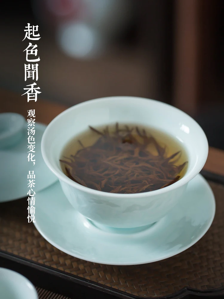 The engraved shadow celadon kung fu tea set cover bowl set is simple, and the whole set of landscape ceramic cover bowl teacups