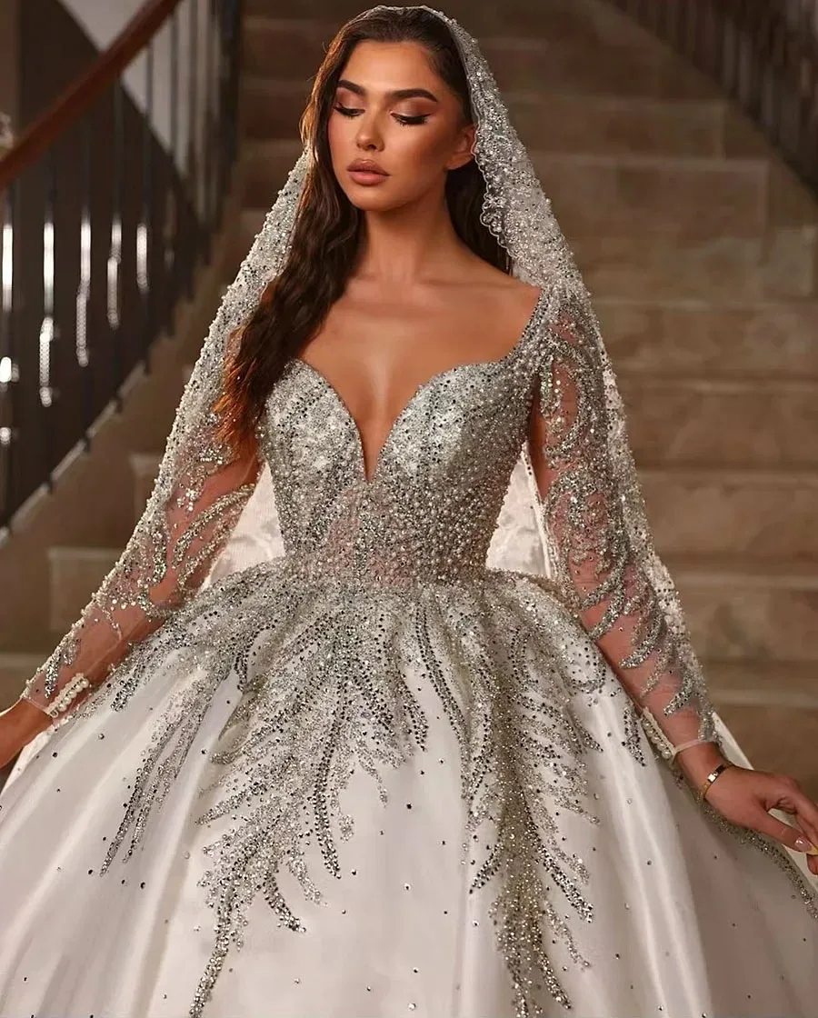 Customized White Wedding Dress With Gorgeous And Elegant Deep V-Neck Design Long Sleeved Rhinestone Decals Fluffy Large Skirt