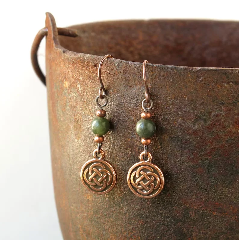 Ethnic-style artificial gemstone paired with Celtic knot pendant earrings for ladies. Perfect for parties and dates.