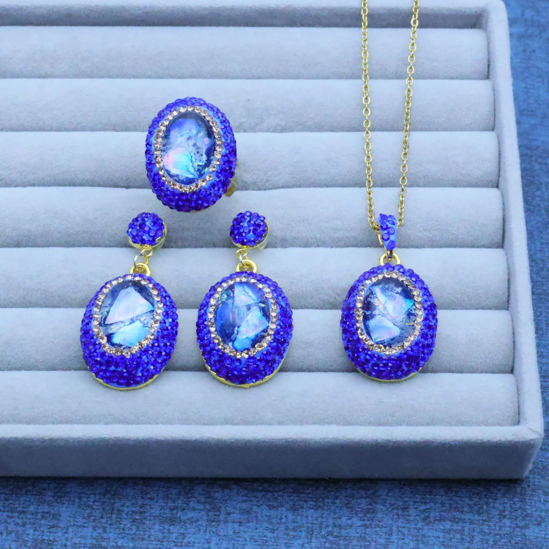 Nuevo producto original europeo y americano, diseño artesanal transfronterizo, con incrustaciones de cristal pintado en concha natural azul, de alta gama y ligero.